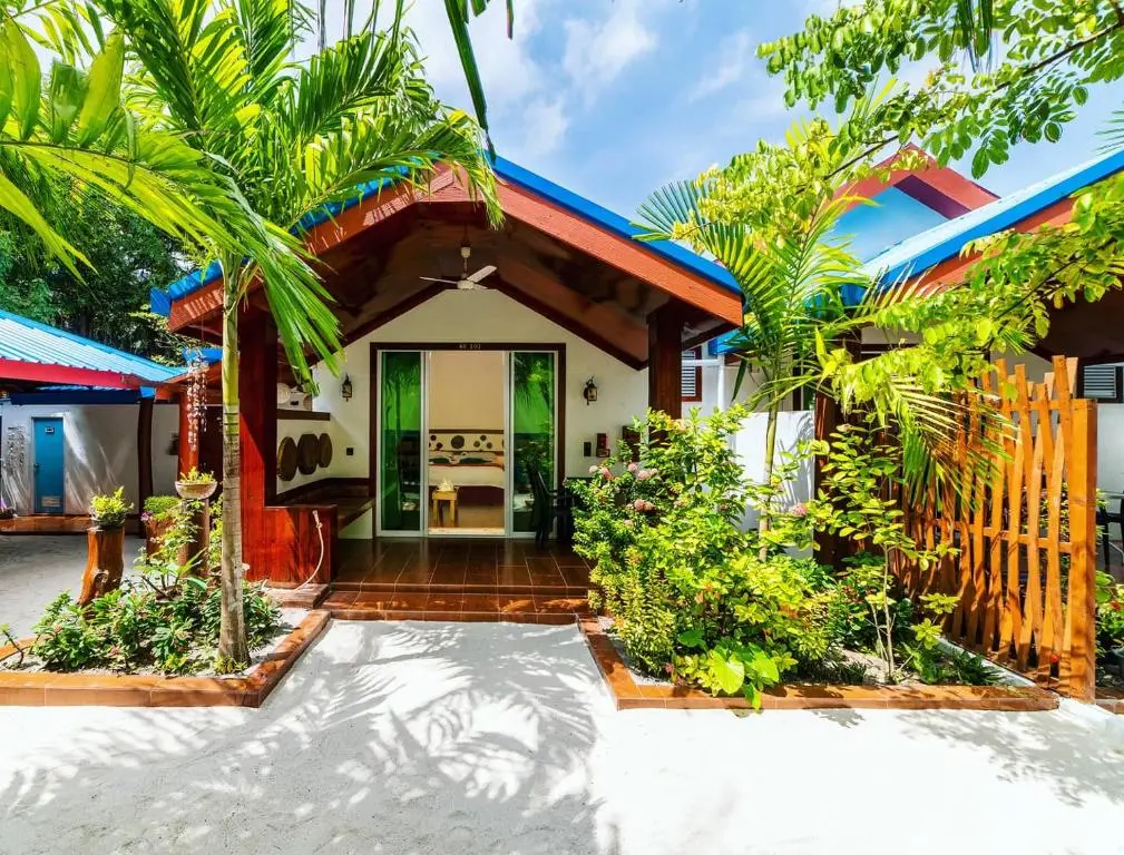Timber villa exterior with a sandy garden path at Beach Villa Ukulhas, Ukulhas Island, Maldives