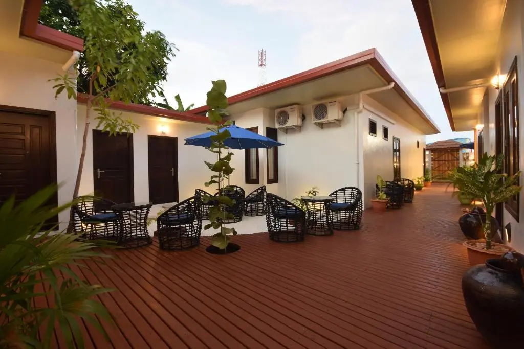 Outdoor terrace seating deck at Island Home Inn, Ukulhas Island, Maldives