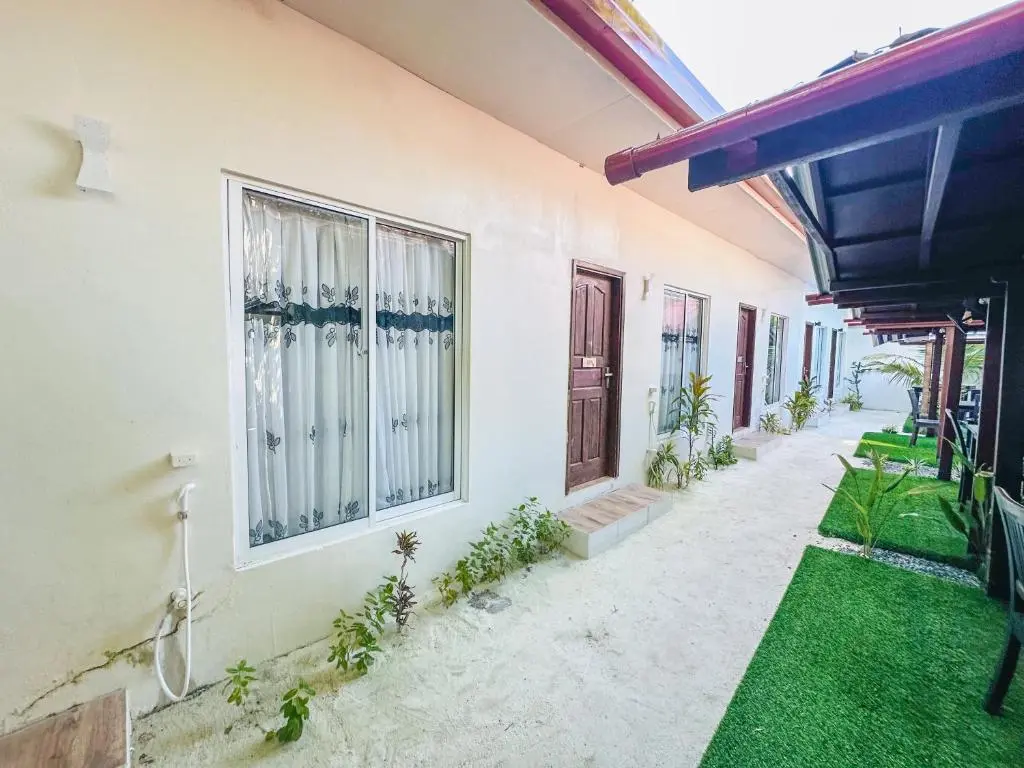 Room entrances along an outdoor walkway at Lacasa Villa, Ukulhas Island, Maldives