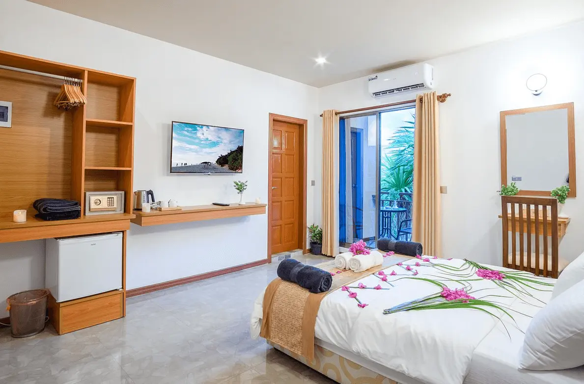 Double guest room with garden-view balcony at Nala Veli Beach and Spa, Ukulhas Island, Maldives