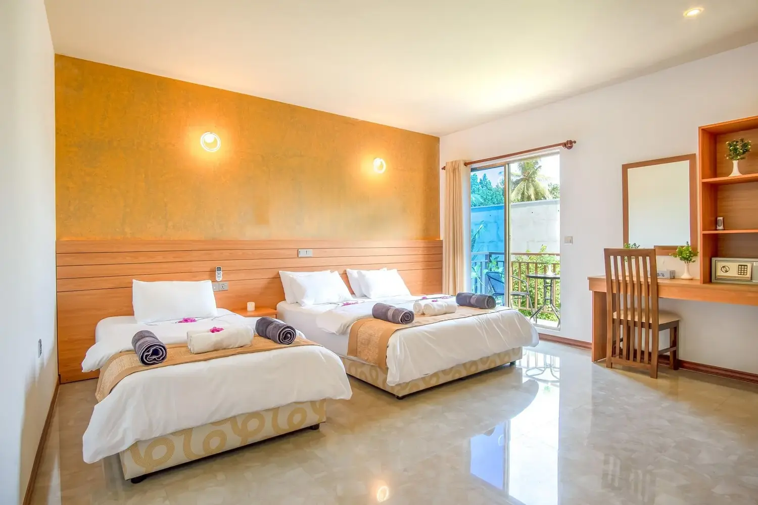 Bright twin guest room with balcony access at Nala Veli Beach and Spa, Ukulhas Island, Maldives