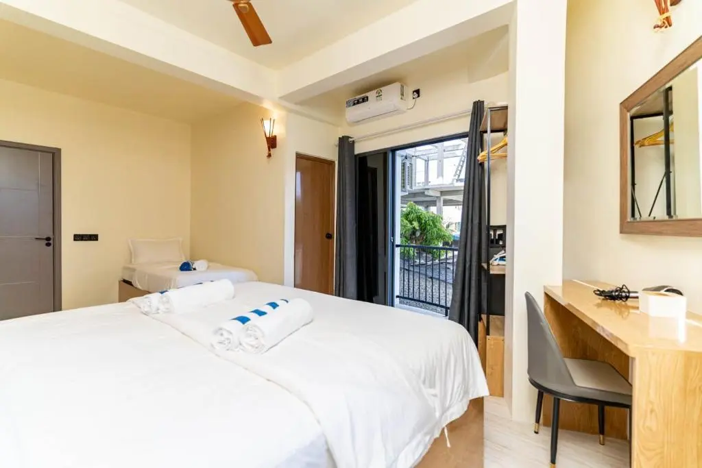 Bright guest room with double bed at White Sand Maldives, Ukulhas Island, Maldives